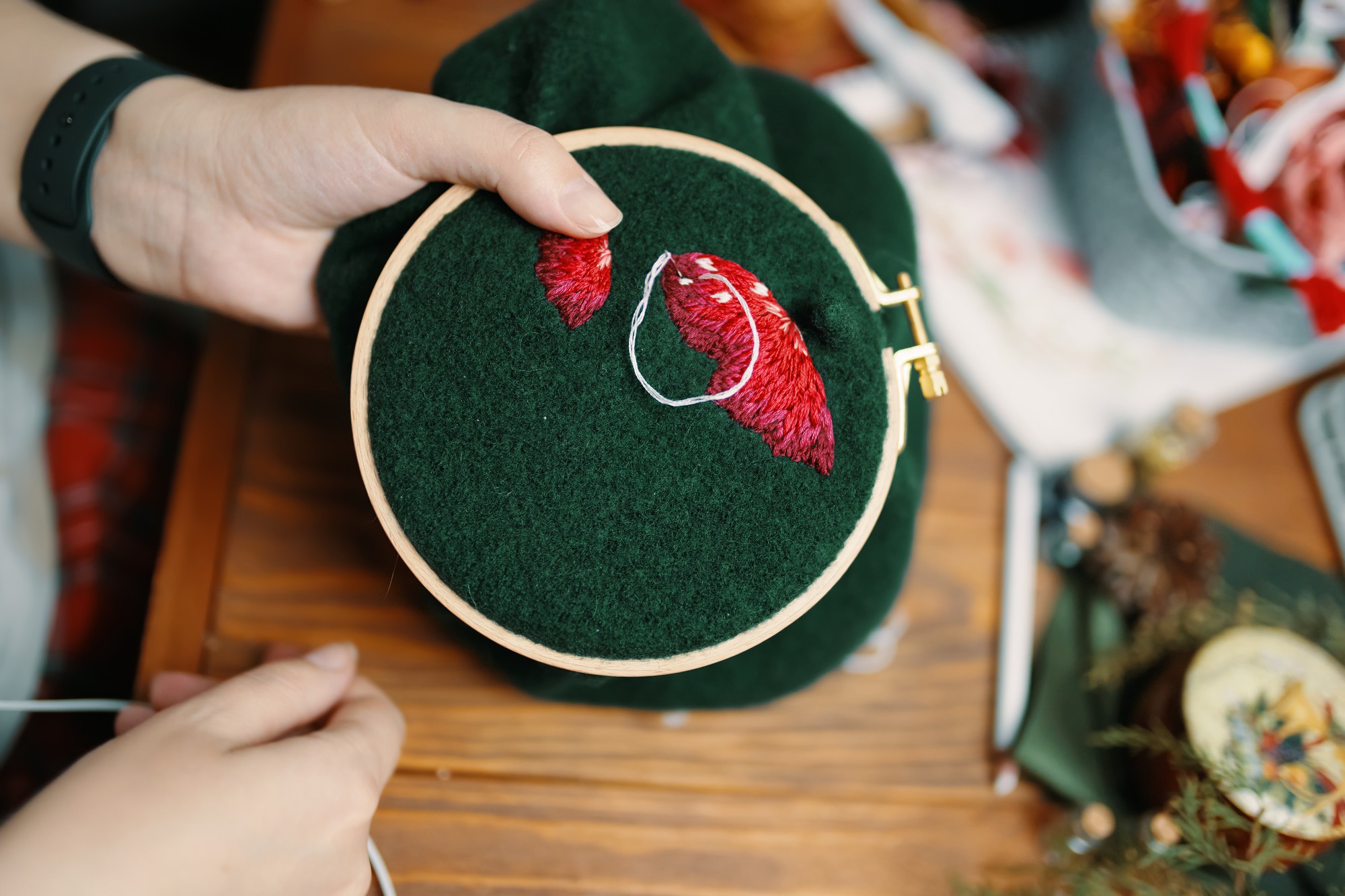 Workshop hands adjusting hoop for embroidery